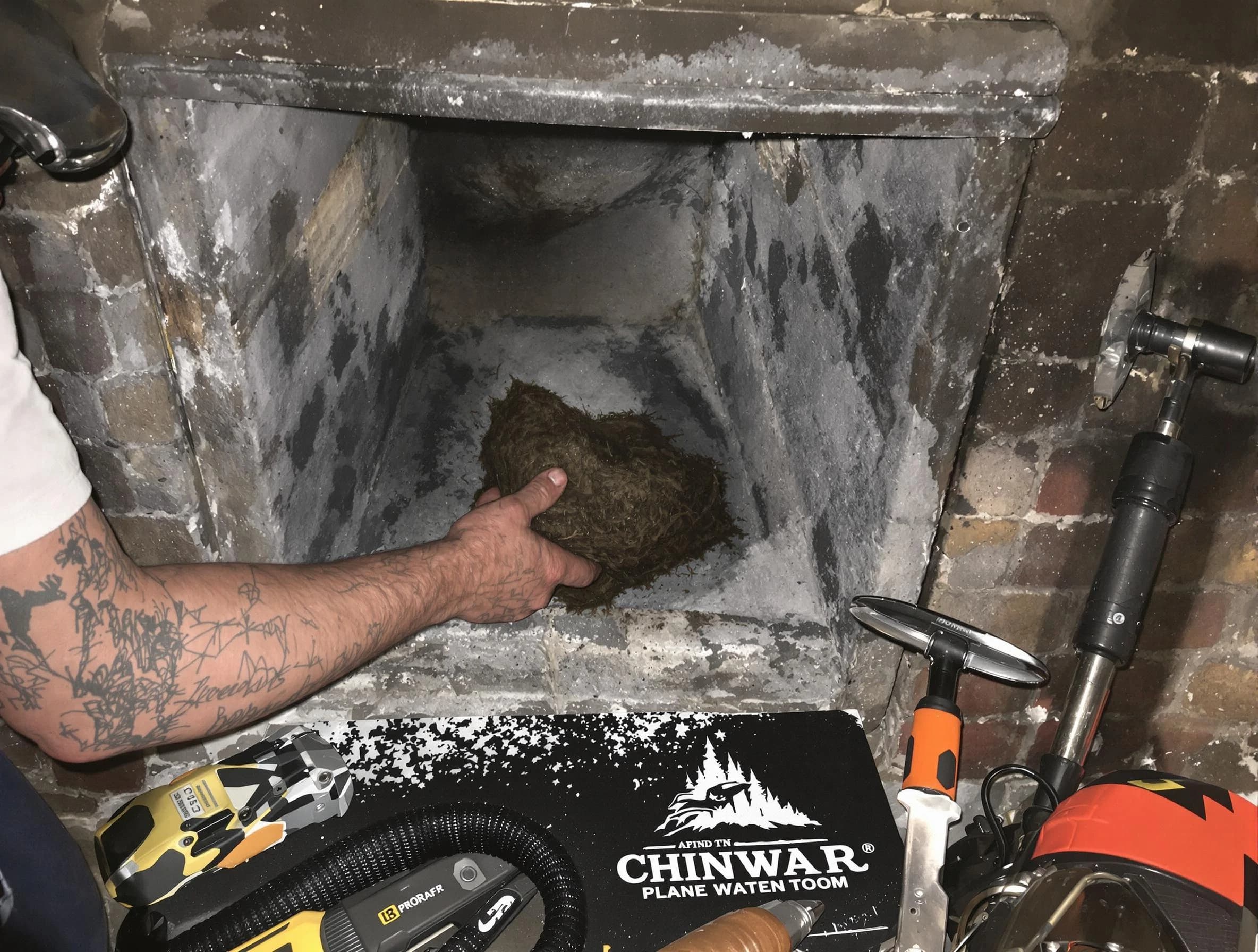 Jonesboro Chimney Sweep safely removing debris and screening chimney in Jonesboro, GA